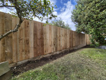 Timber fence on top of Retaining wall