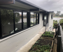 Extensive exterior renovation - Brickwork was plastered over and painted, soffits repainted, spouting repainted in spray finish