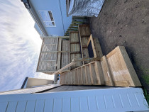 Creating beautiful spaces - This area was previously a unusable slope with very limited access.
 With the clever use of retaining walls, construction of stairs and extending the deck we created a beautiful and private entertainment area at the top and completely transformed the front of the house