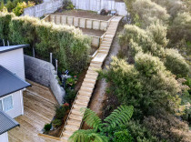 Champagne views on a beer budget - This was one of the best projects I've ever taken on. 
The site was challenging, the ground was hard, and the access was terrible. 
 And the results speak for themselves, the client wanted straight lines and good access, and maximize the usable space.
 I'd say we nailed it