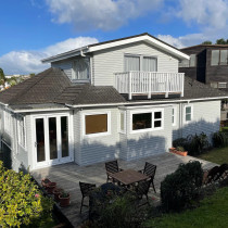 Exterior repaint. - You can't tell now, but the owners bought a home with a run down exterior. Old paint was stripped and new paint was applied to make it look as good as new.