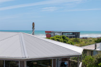Expertly offering and installing NZ's Highest quality coloursteel roofing to Waitarere beach. - Sandstone grey at Waitarere beach.