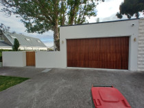 Float finish over brick garage and block landscaping walls