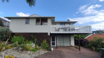 Painting the weatherboard and oiling the deck