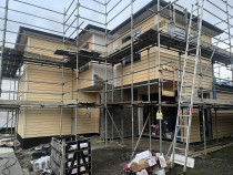 New build - Timber weather boards done and schist stone cladding half way through for a new build in Lynfield