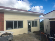Roof upgrade and Reclad (Part 2) - This image shows the new roof and cladding complete, with all new windows and doors.
Such a transformation by Top 2 Bottom Carpentry Ltd!