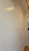 Prepare and finish bare gib walls with plastering and a gloss topcoat - I completed a new laundry and storage room at home. The process included taping gib joins, plastering over screws and other imperfections, applying an undercoat, and finishing with two coats of Dulux Wash & Wear gloss finish. While gloss is not typically used on interior walls due to its tendency to highlight surface flaws, I opted for it as it was readily available.