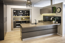 Innovative Kitchens - Mt Roskill Showroom - Minimalist design with sliding doors to hide away the scullery, narrow pantries and glass door overhead cupboard.
