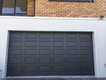 Garage Door repainted by H2GLO Services - Garage door completed repaint after repairs and prepped for final coatings.