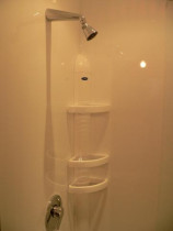 Bathrooms by Buildstrong - Shower cubicle relined and door fitted.