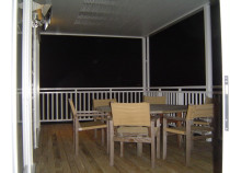 Wood Renovations - New deck, handrail, and slatted roof with clear panels.
